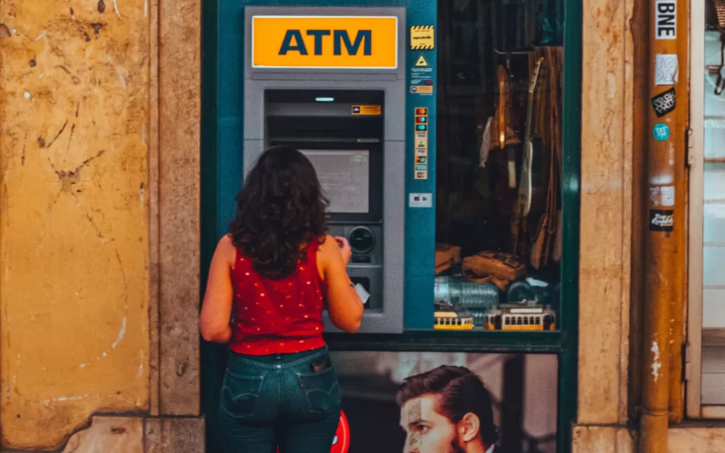 Woman using ATMs abroad